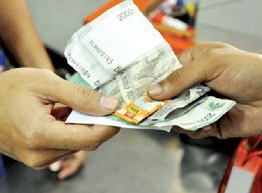 Uang Kembalian Pakai Permen, Pedagang Terancam Pidana